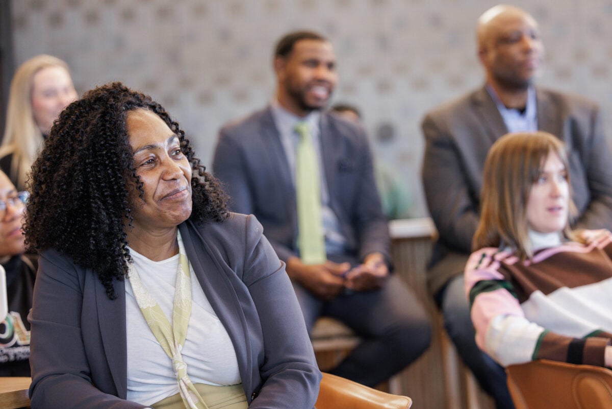 group of colleagues listening to a presentation