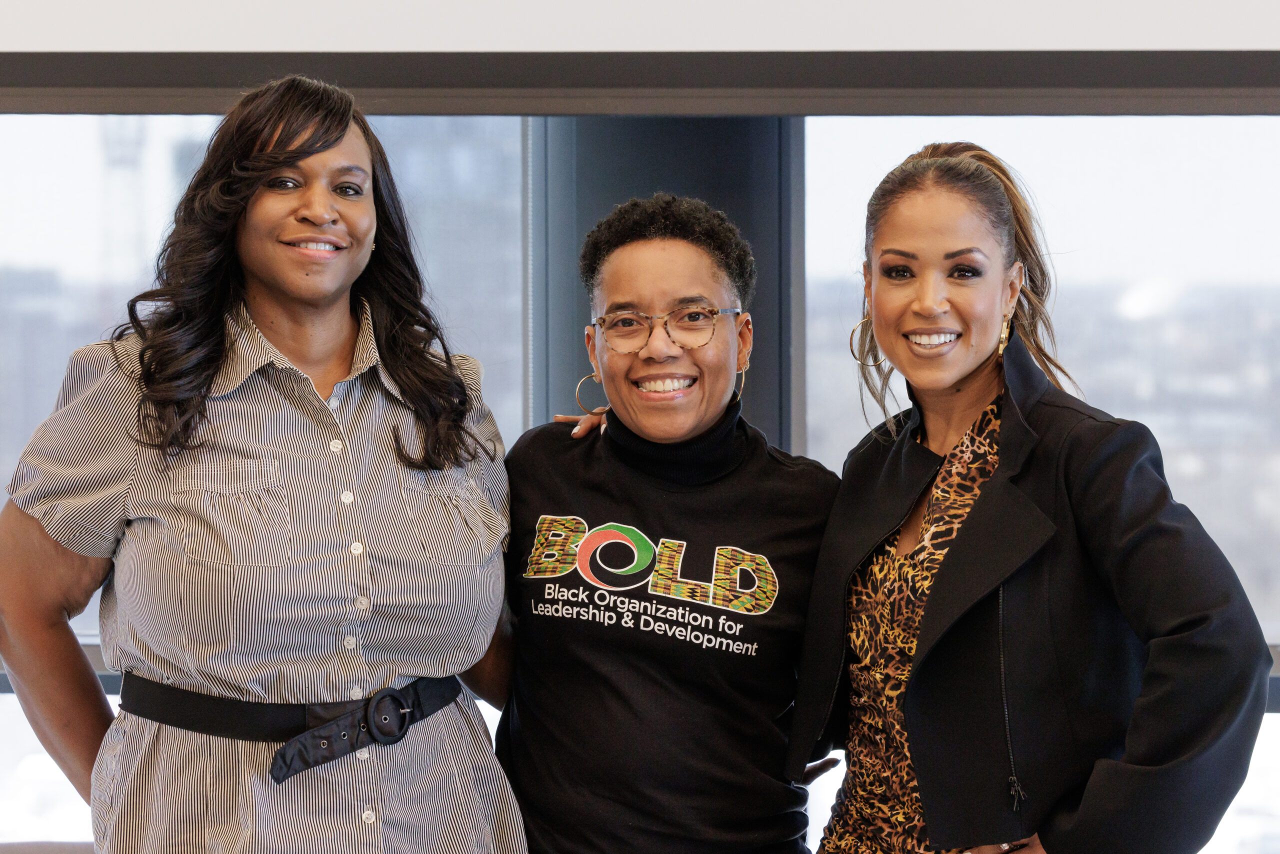 two women members of the BOLD team posing with Val for a photo
