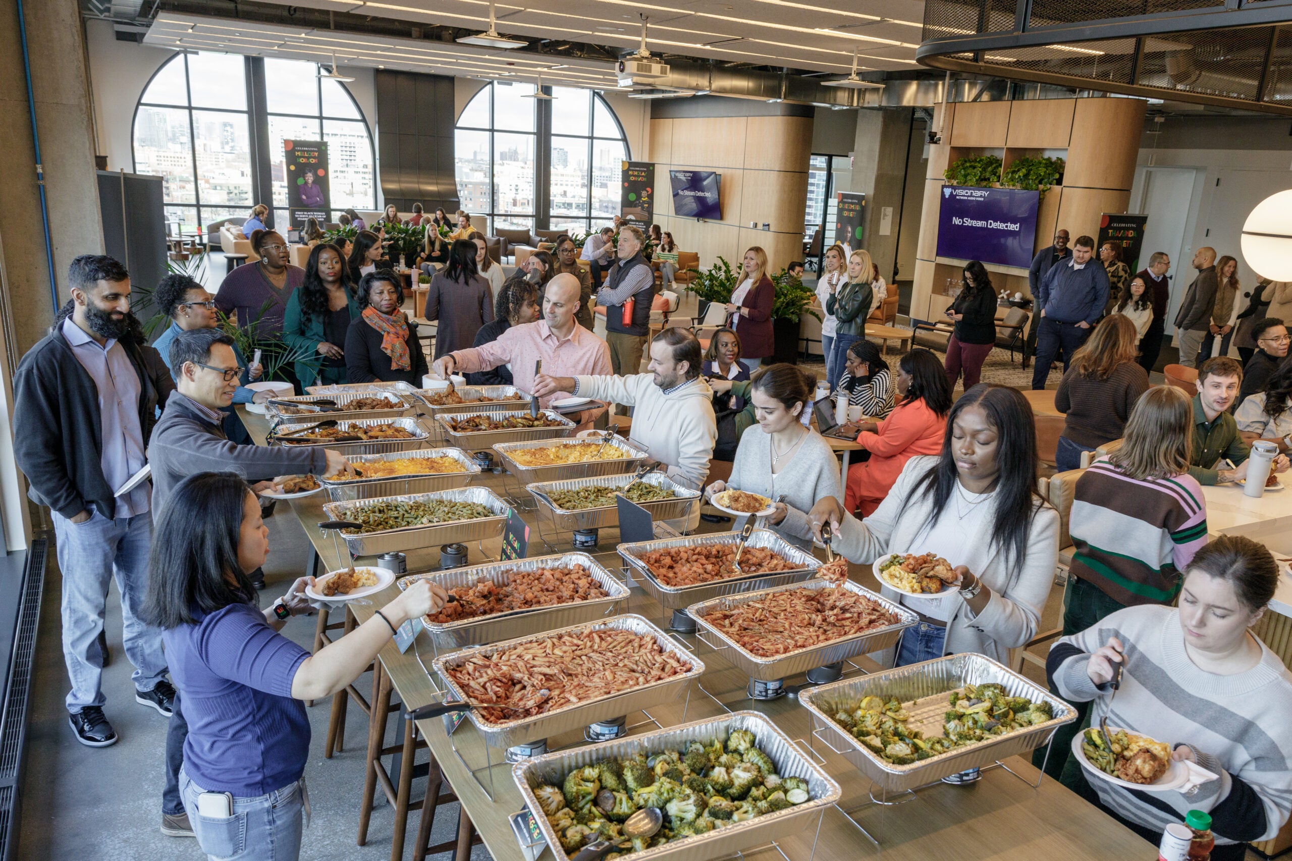 Listeners enjoying a soul food buffet before the program starts