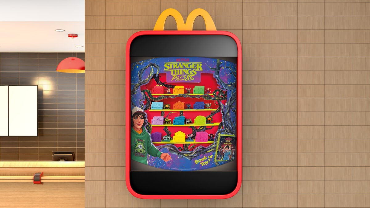 McDonald's toy case with a lineup of Stranger Things Happy Meal toys