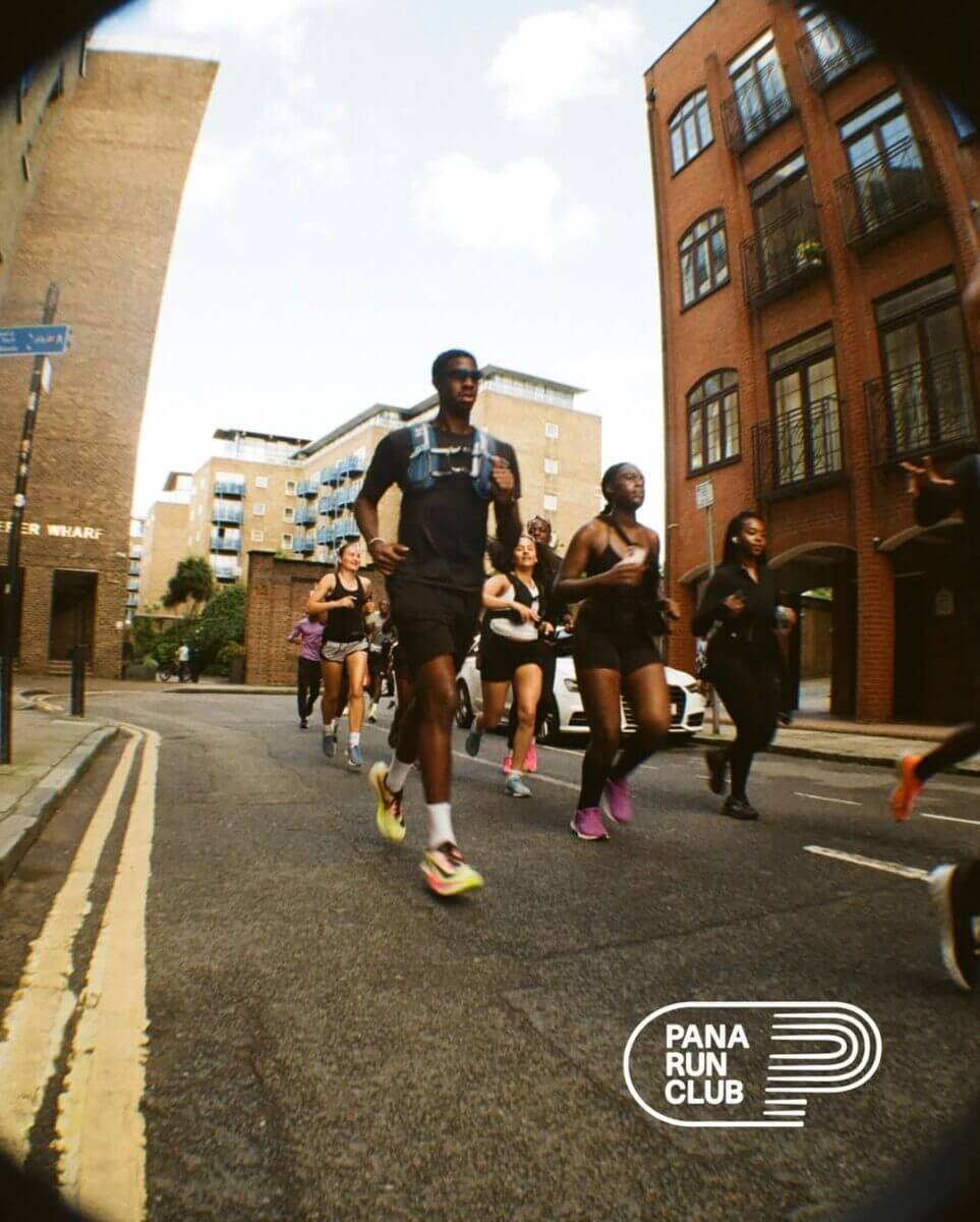 A group of people running in a city