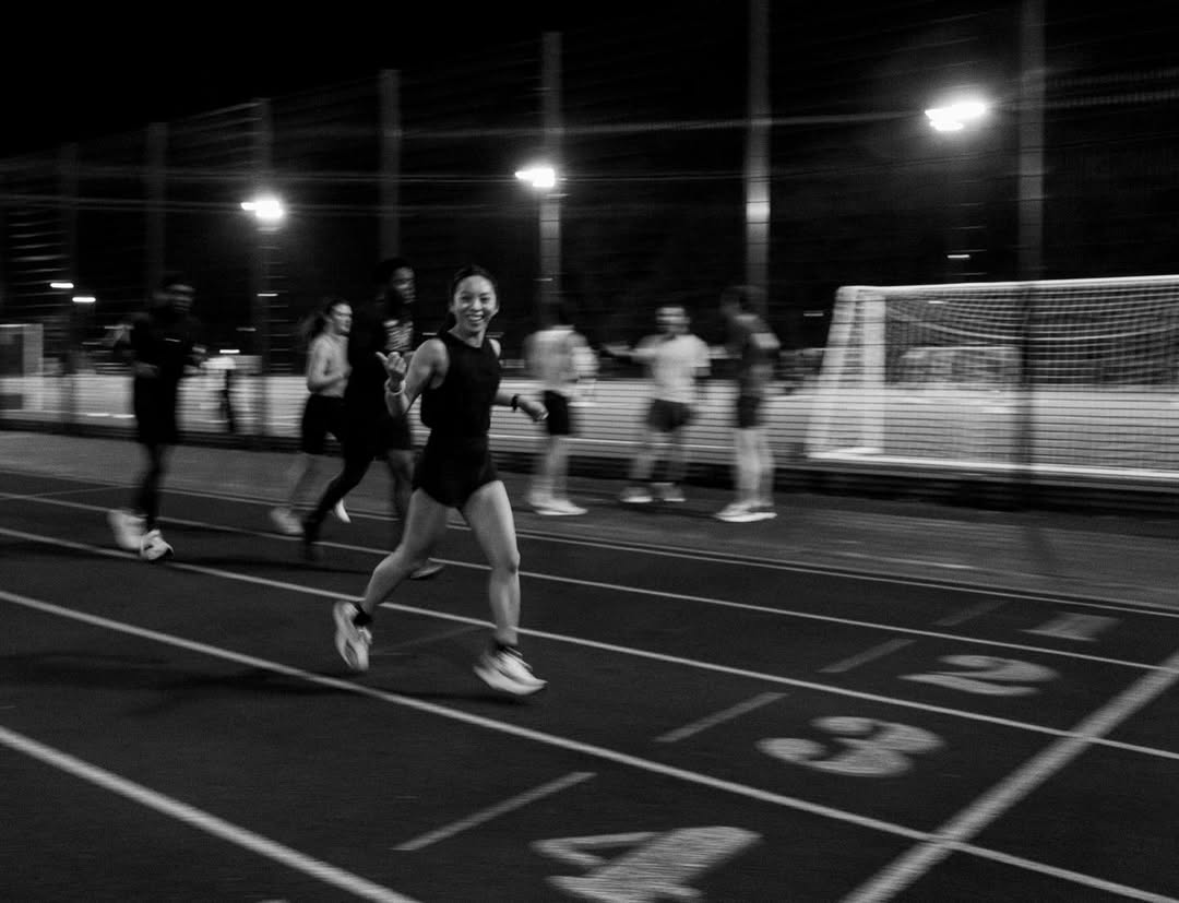A woman running on a track