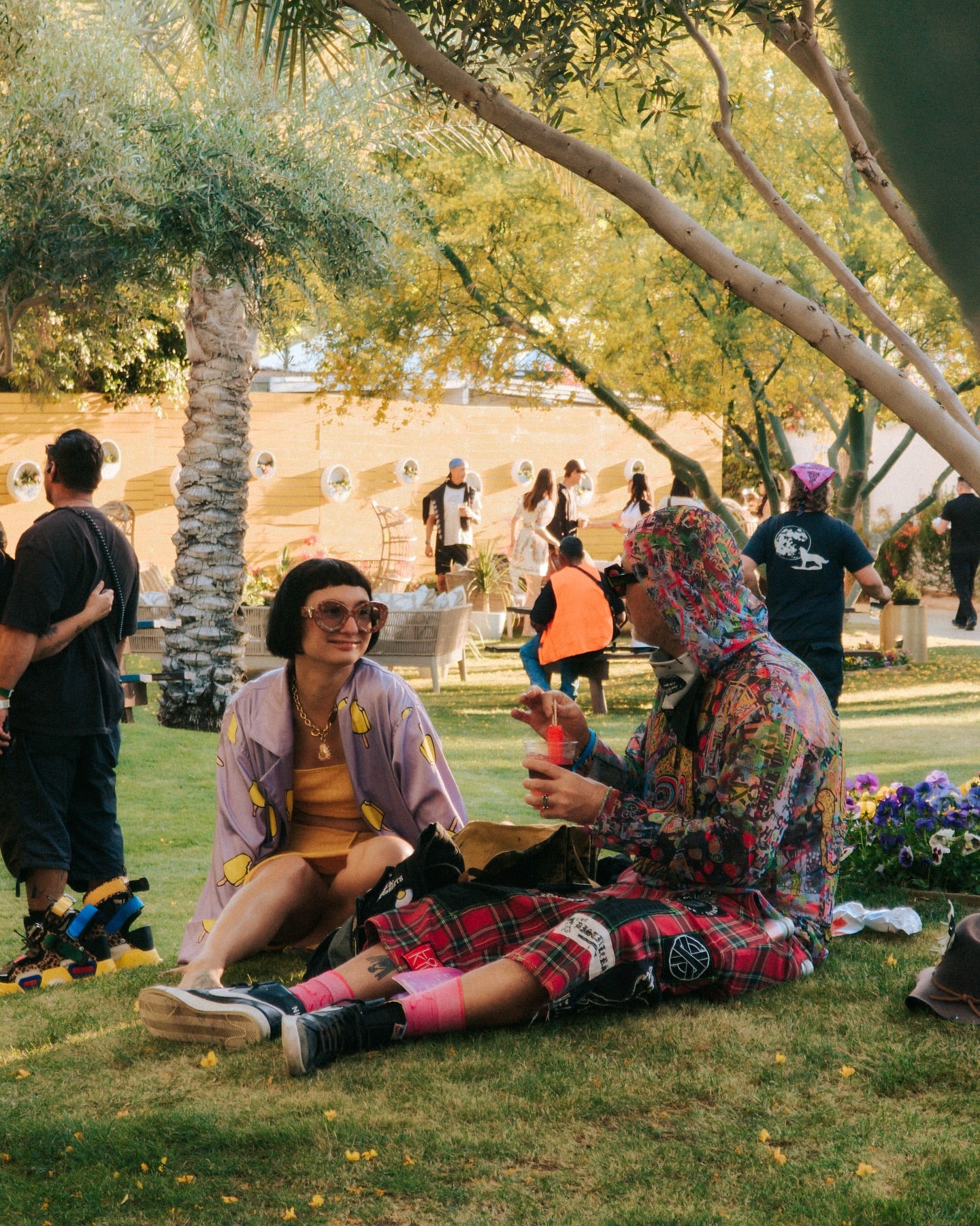 Concert-goers sitting at a festival