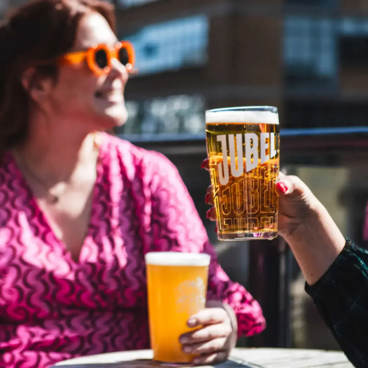 Two people drinking a beer