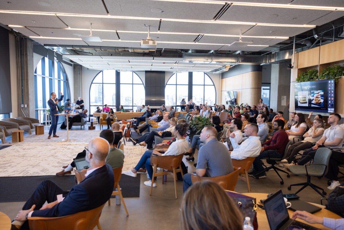 Crowd of people listening to AI summit