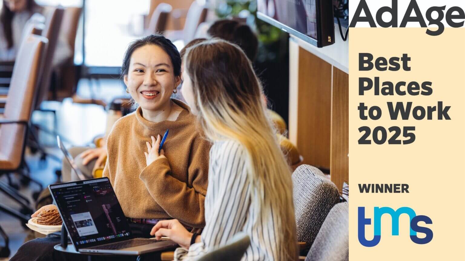 Two women speaking with the Ad Age Award logo on the right