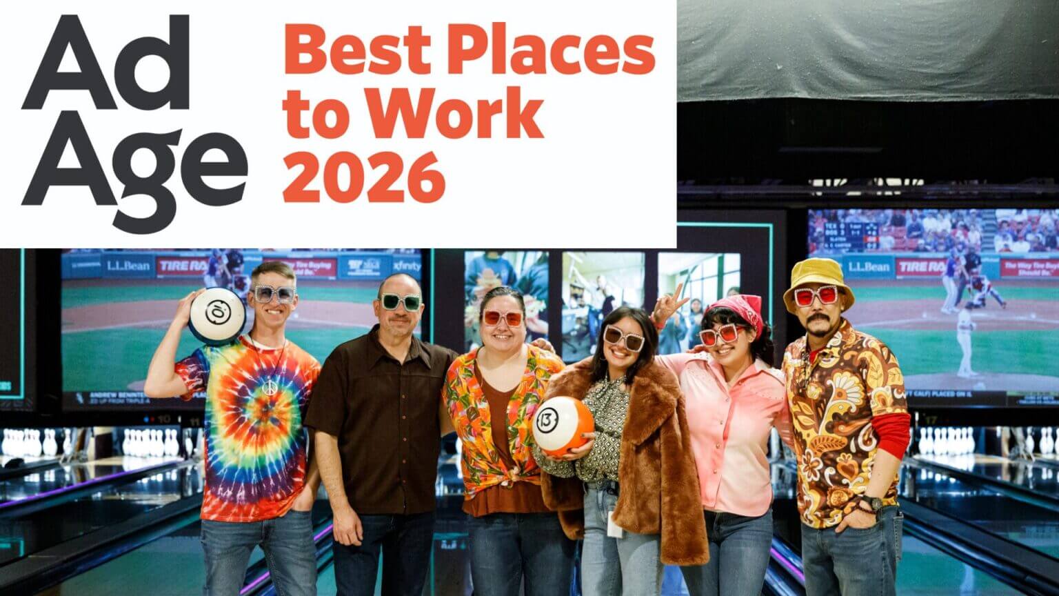 award logo in top right with group of employees in the centre