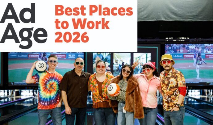 award logo in top right with group of employees in the centre