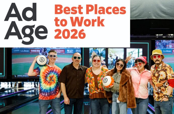 award logo in top right with group of employees in the centre