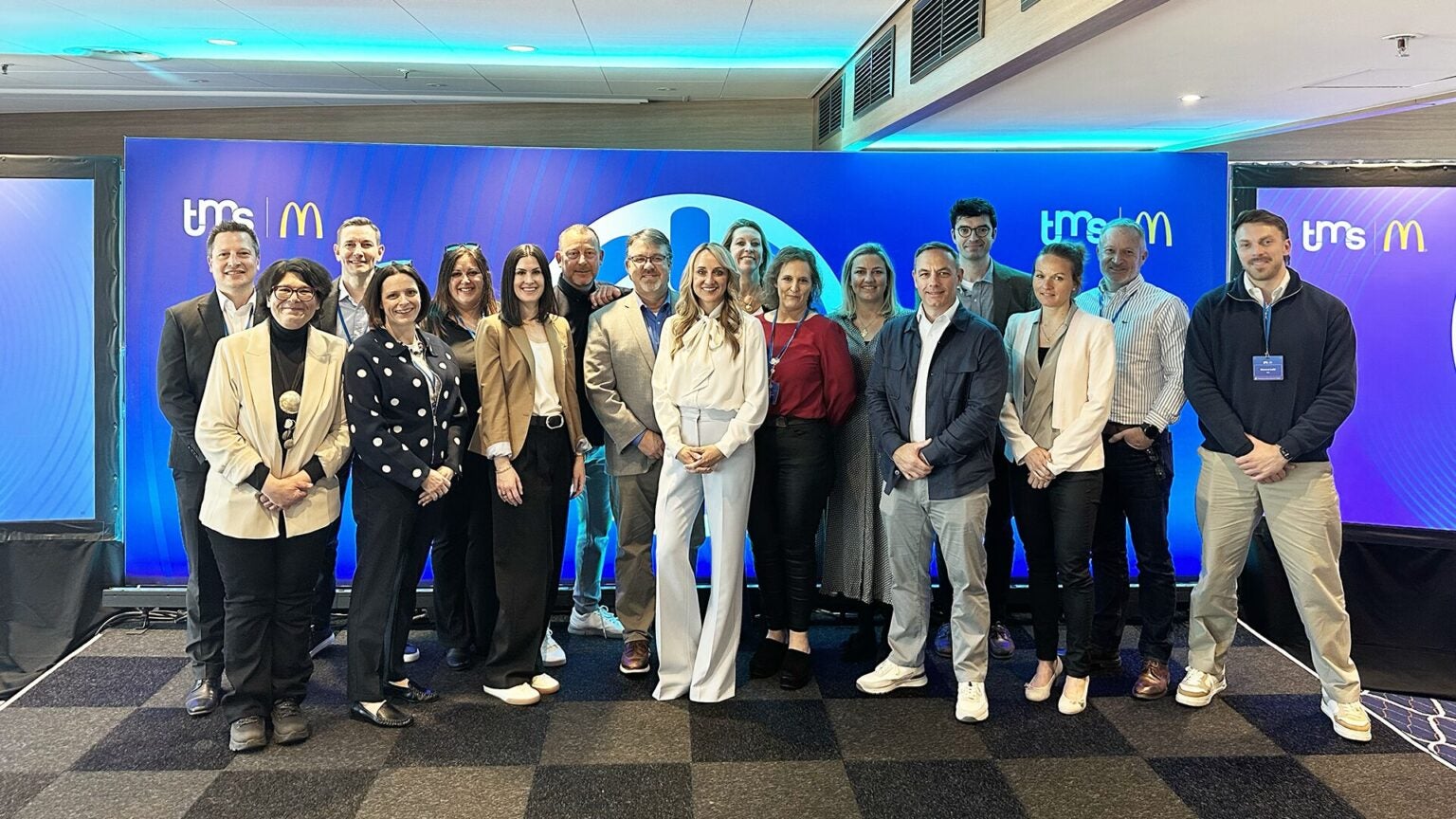 A group of colleagues posing for a photo at the Amsterdam Supplier Forum