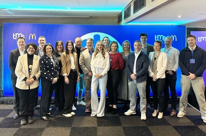 A group of colleagues posing for a photo at the Amsterdam Supplier Forum
