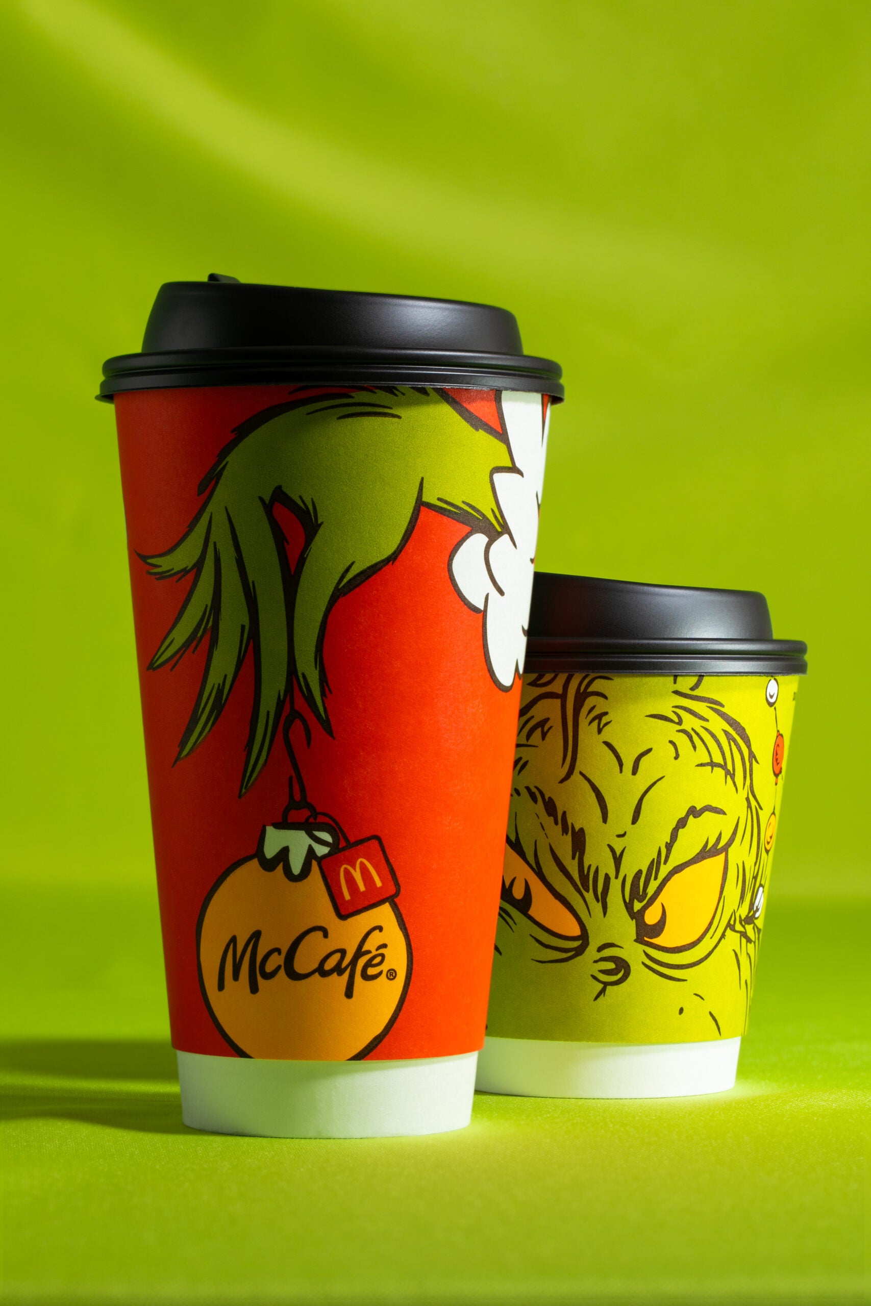 Two Grinch Meal hot cups featuring the Grinch