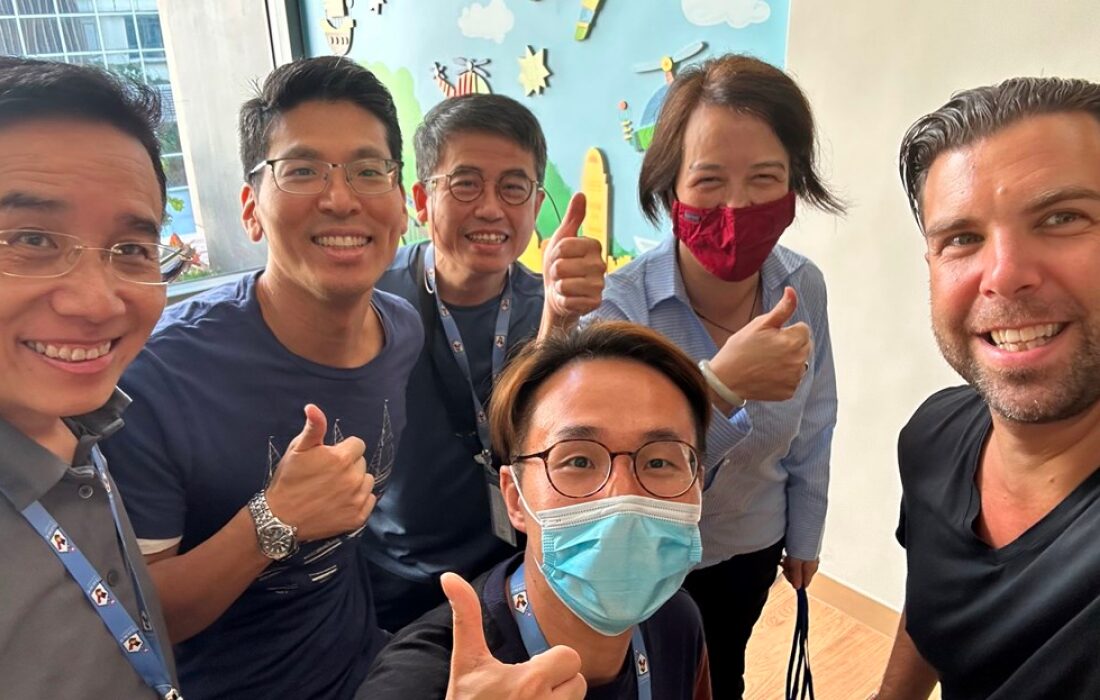 People smiling at the camera taking a selfie at RMHC Hong Kong