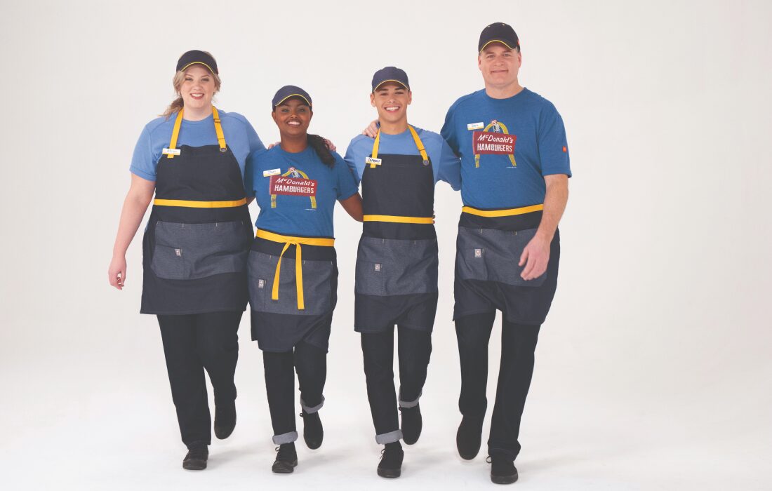4 McDonald's employees in the new uniforms