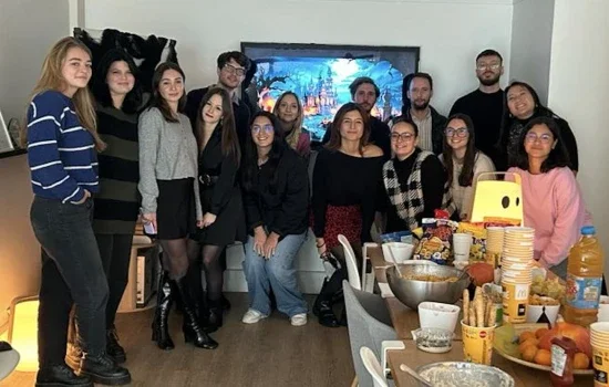 tms Paris employees gathered for their Halloween lunch posing for a photo