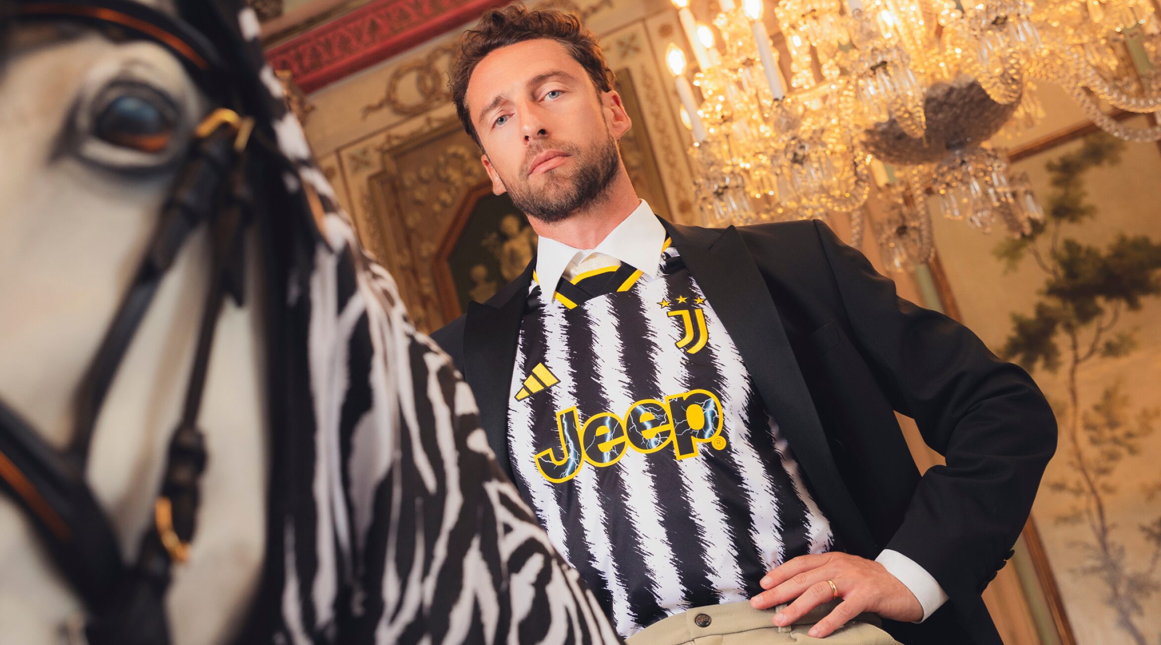 A man in Juventus uniform posing for the camera