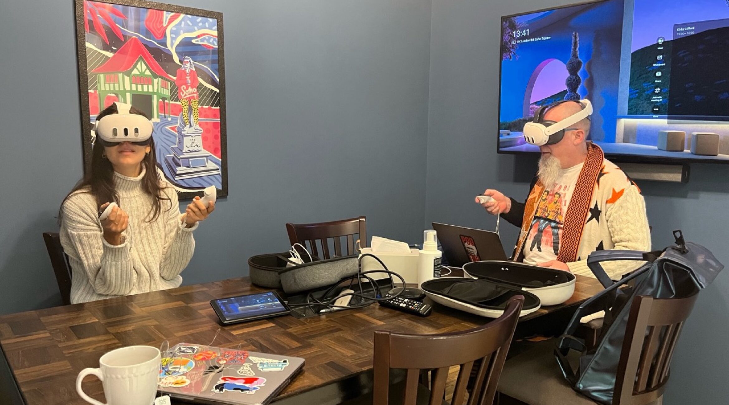 2 people using VR headsets sitting down