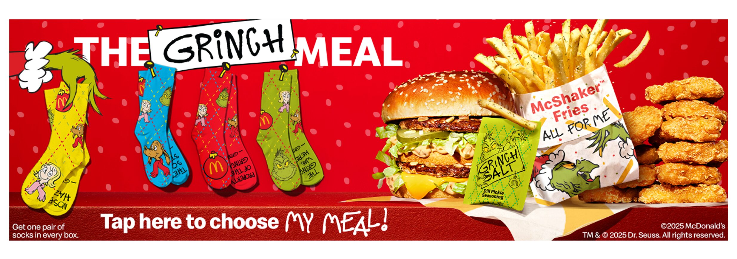 The Grinch Meal retail poster with the meal itself and 4 sock styles