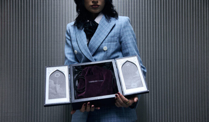 A woman holding a MSCHF box with the Galaxy Ring