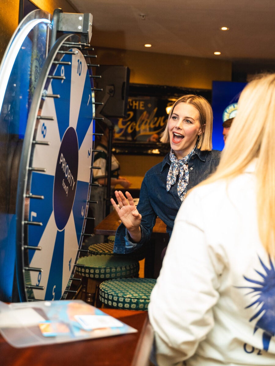 A woman playing the spin wheel
