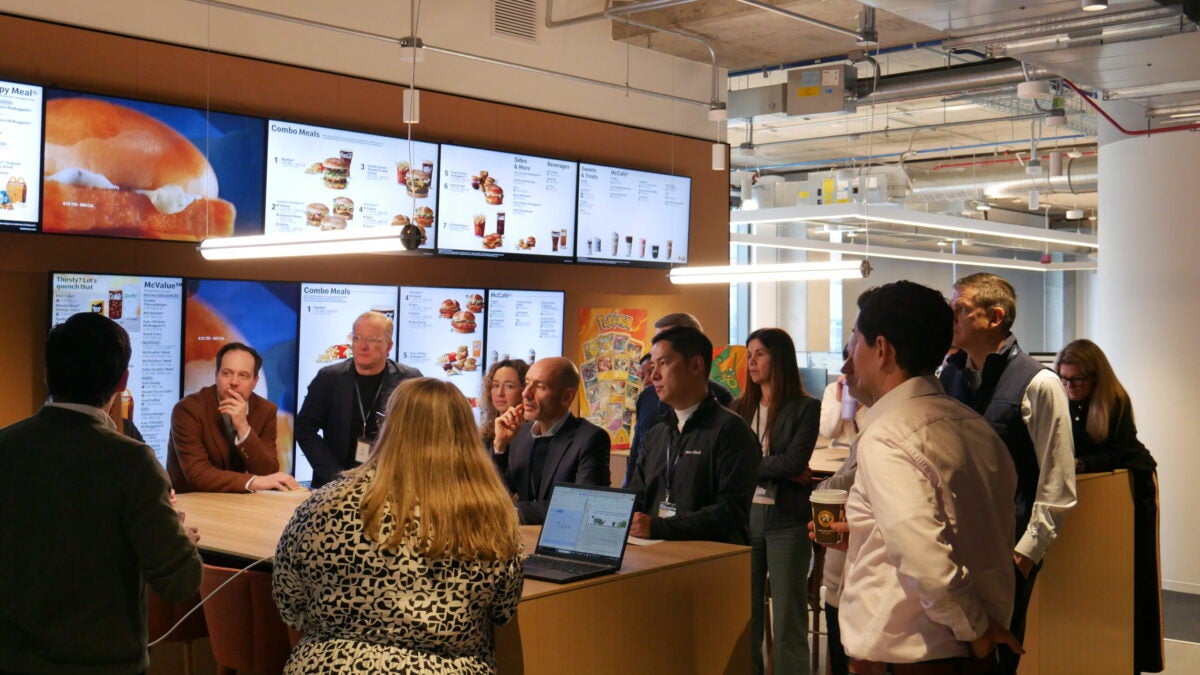 People watching a McDonald's menuboard presentation