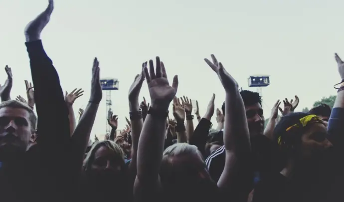 Young people with arms raised