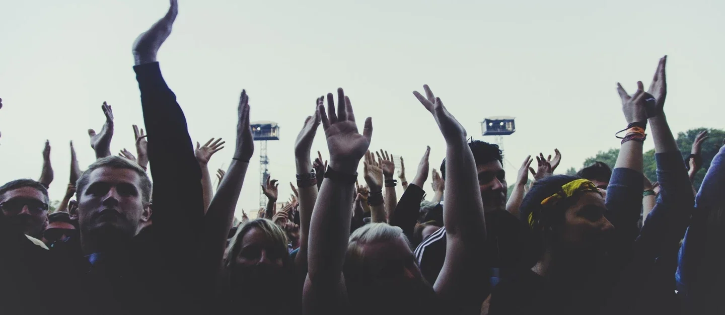 Young people with arms raised