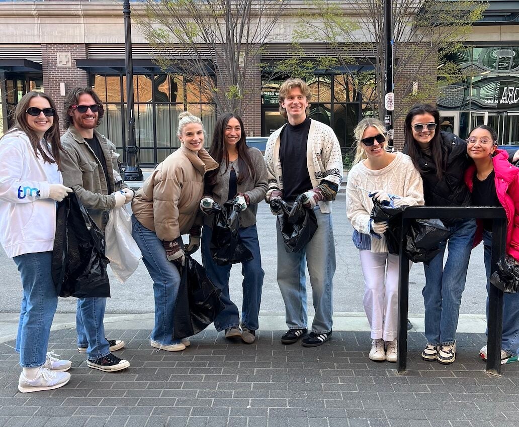 Group of people posing for photo at cleanup