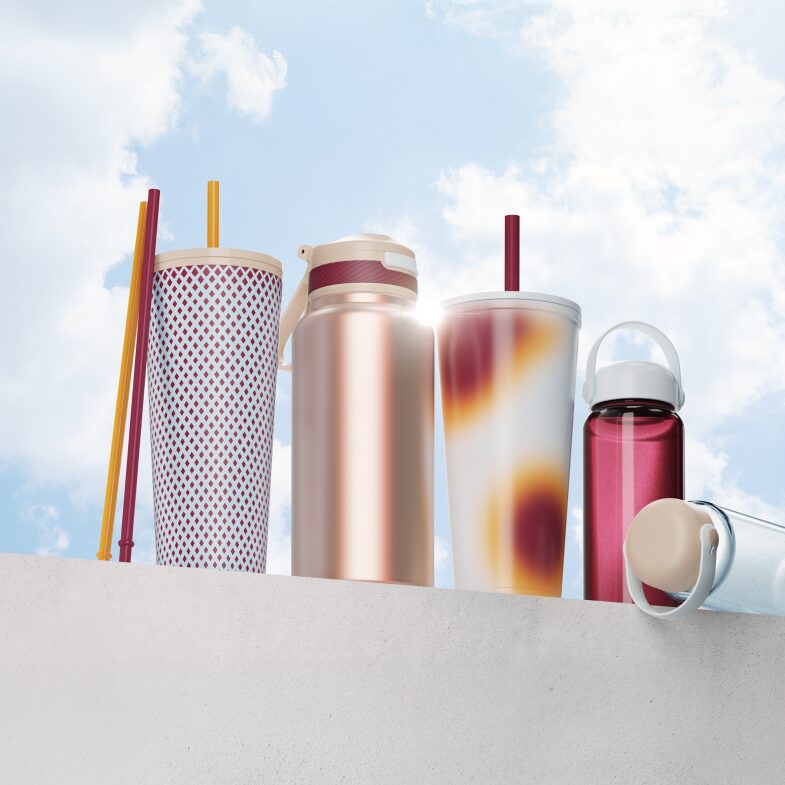 5 tumblers and 2 straws against blue sky background