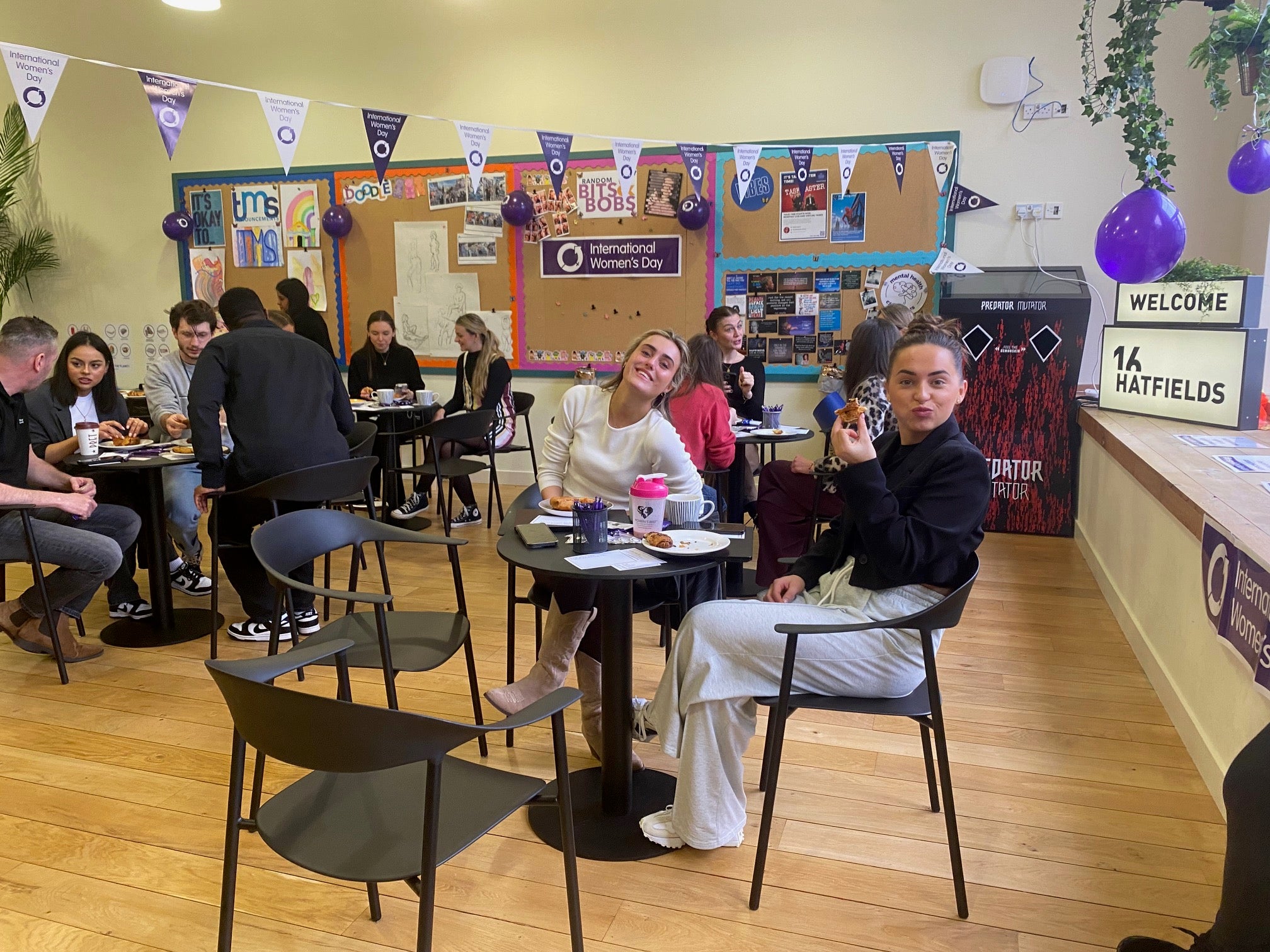 Image of colleagues attending the london office IWD event sitting down