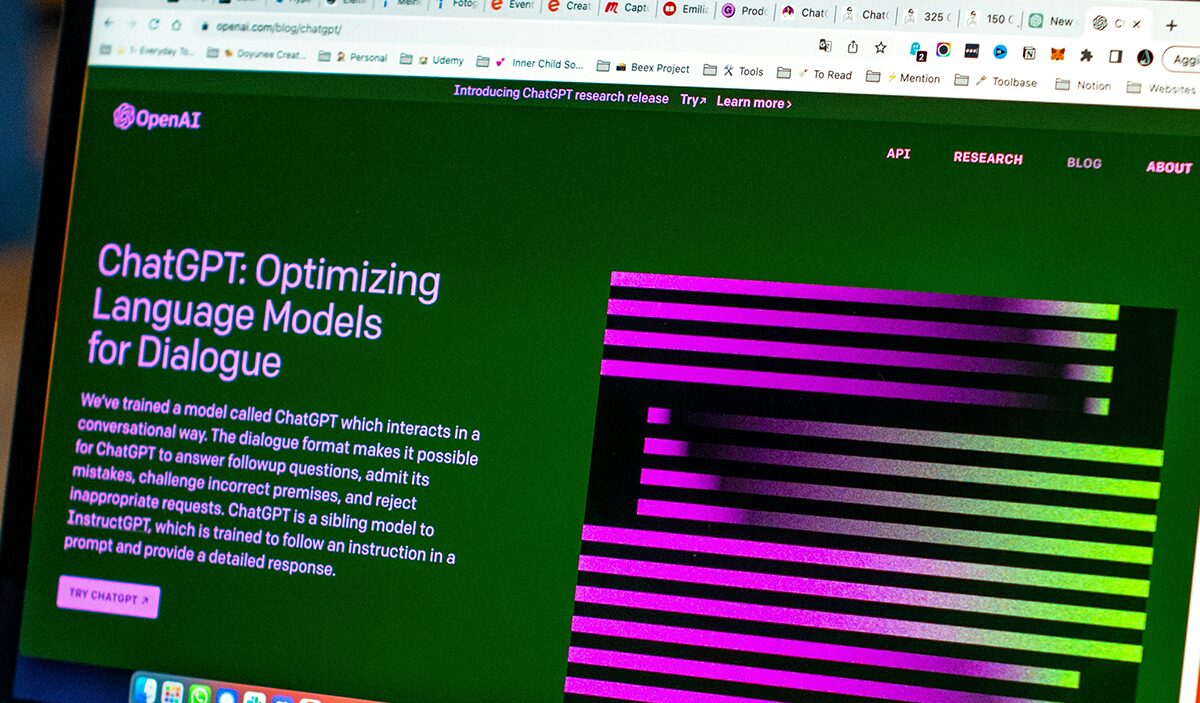 Laptop screen showing the ChatGPT research page