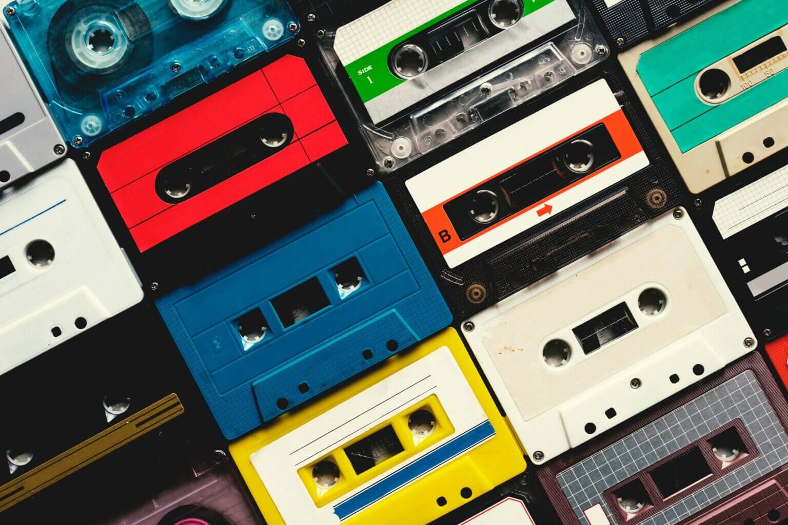 Colourful cassette tapes displayed in an orderly grid
