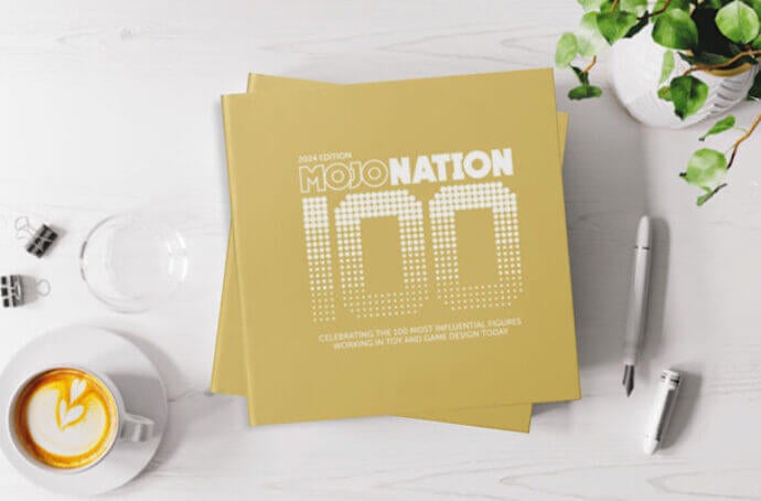 Image of a desk with gold cards stating "Mojo Nation 100"