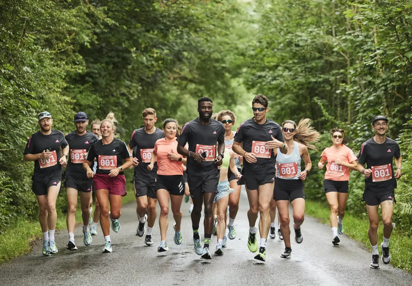 group of people running on a road