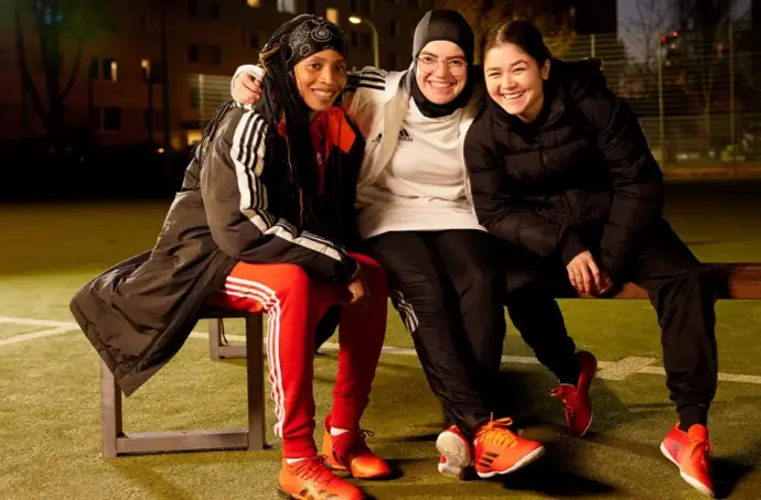Three athletes on a bench