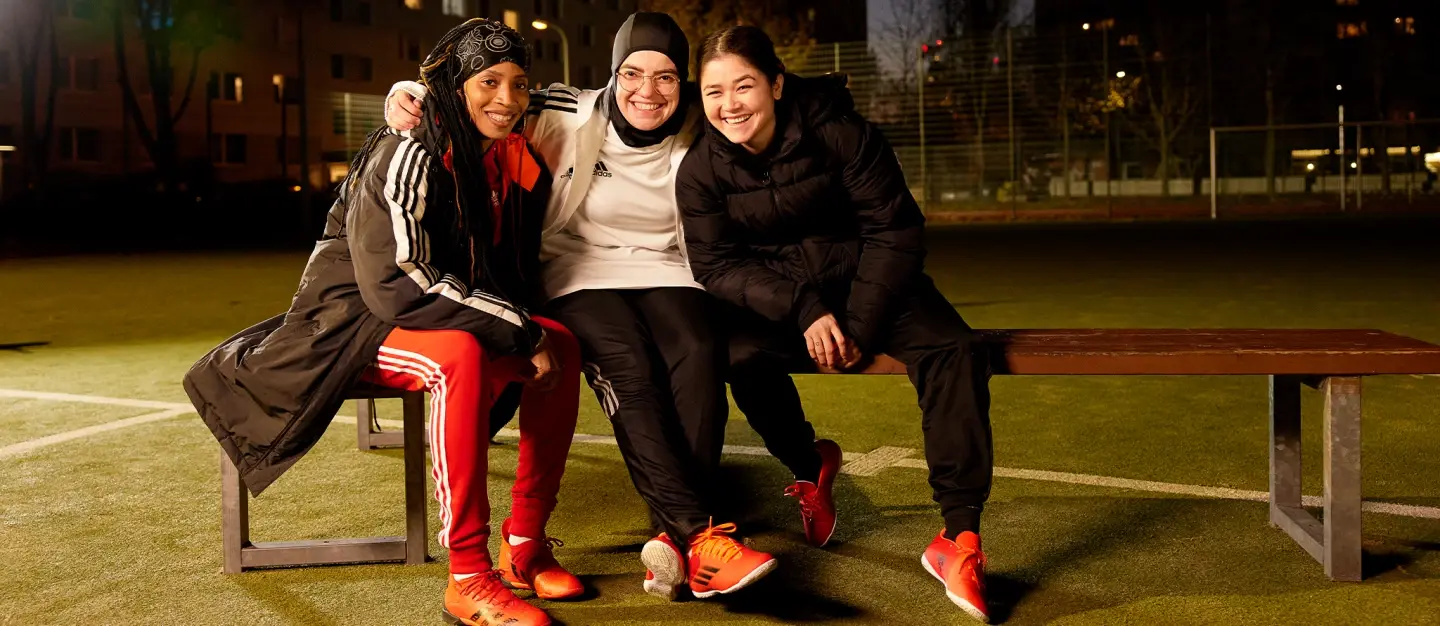 Three athletes on a bench