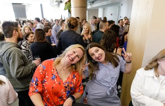 Employees smiling at opening