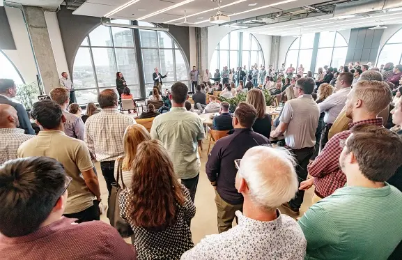 Employees listening to opening speech