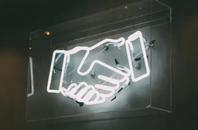 handshake fluorescent sign