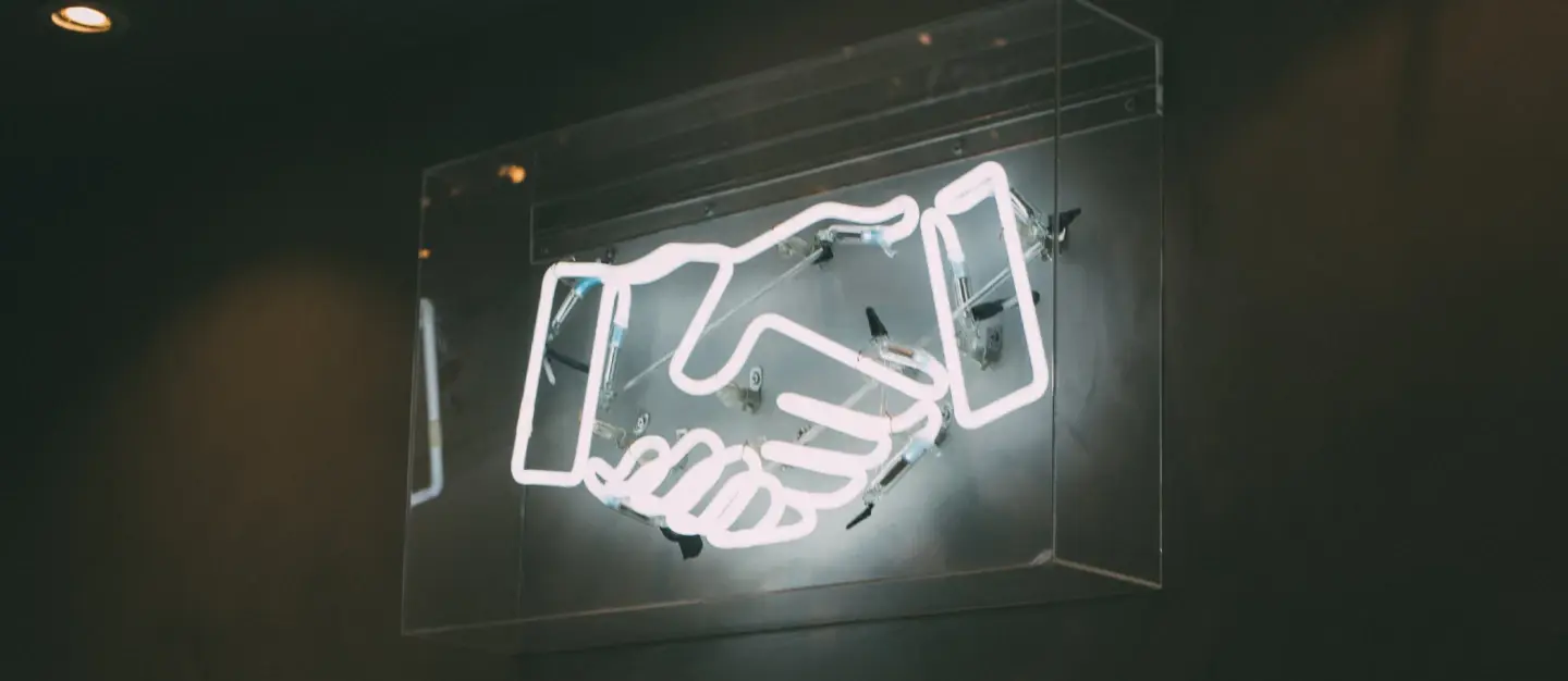 handshake fluorescent sign