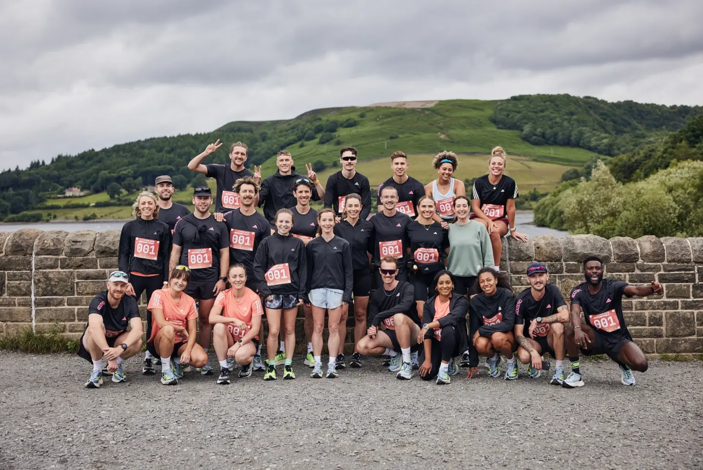 Group of people in front of Ladybower Dam