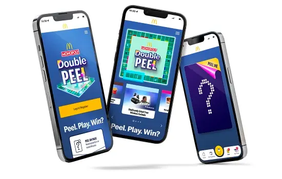 Three phones featuring the Double Peel Monopoly game in the McDonald's app