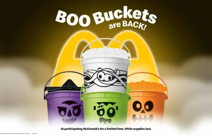4 Halloween Happy Meal Boo Buckets against McDonald's Logo