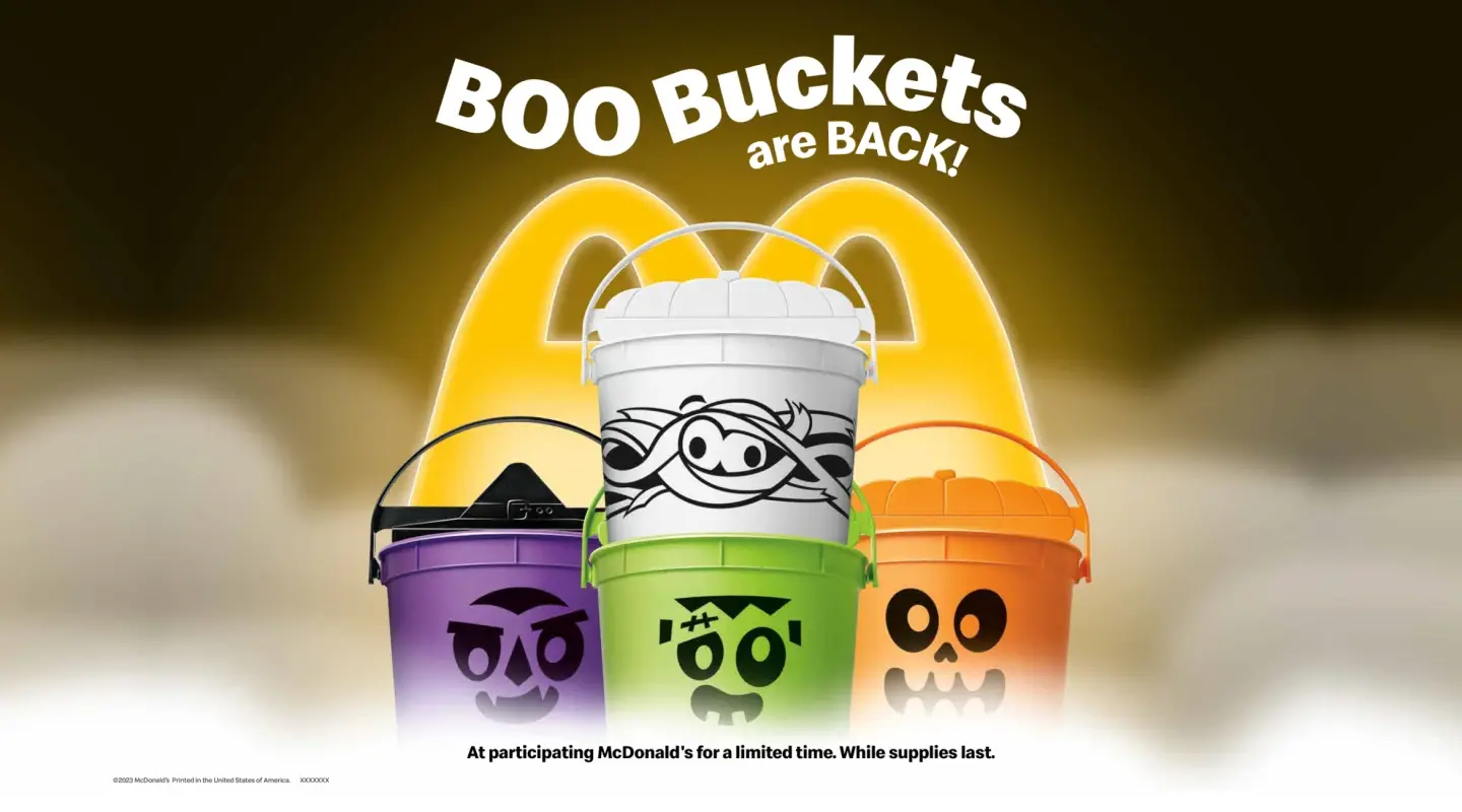 4 Halloween Happy Meal Boo Buckets against McDonald's Logo