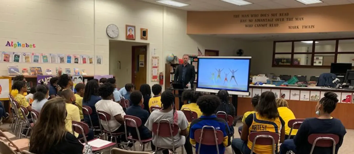 children and teacher in a classroom