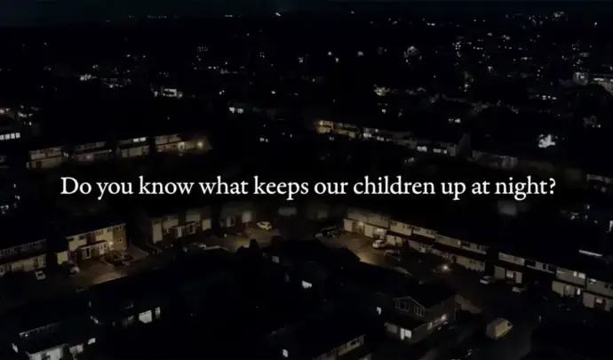 City at night with text overlay saying "Do you know what keeps our children up at night?"