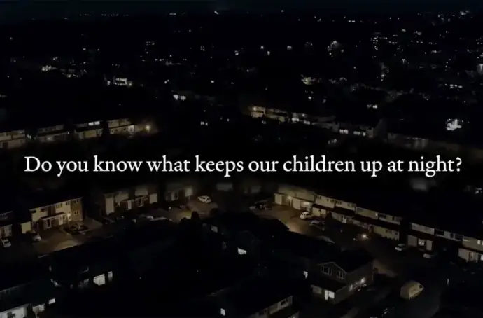 City at night with text overlay saying "Do you know what keeps our children up at night?"