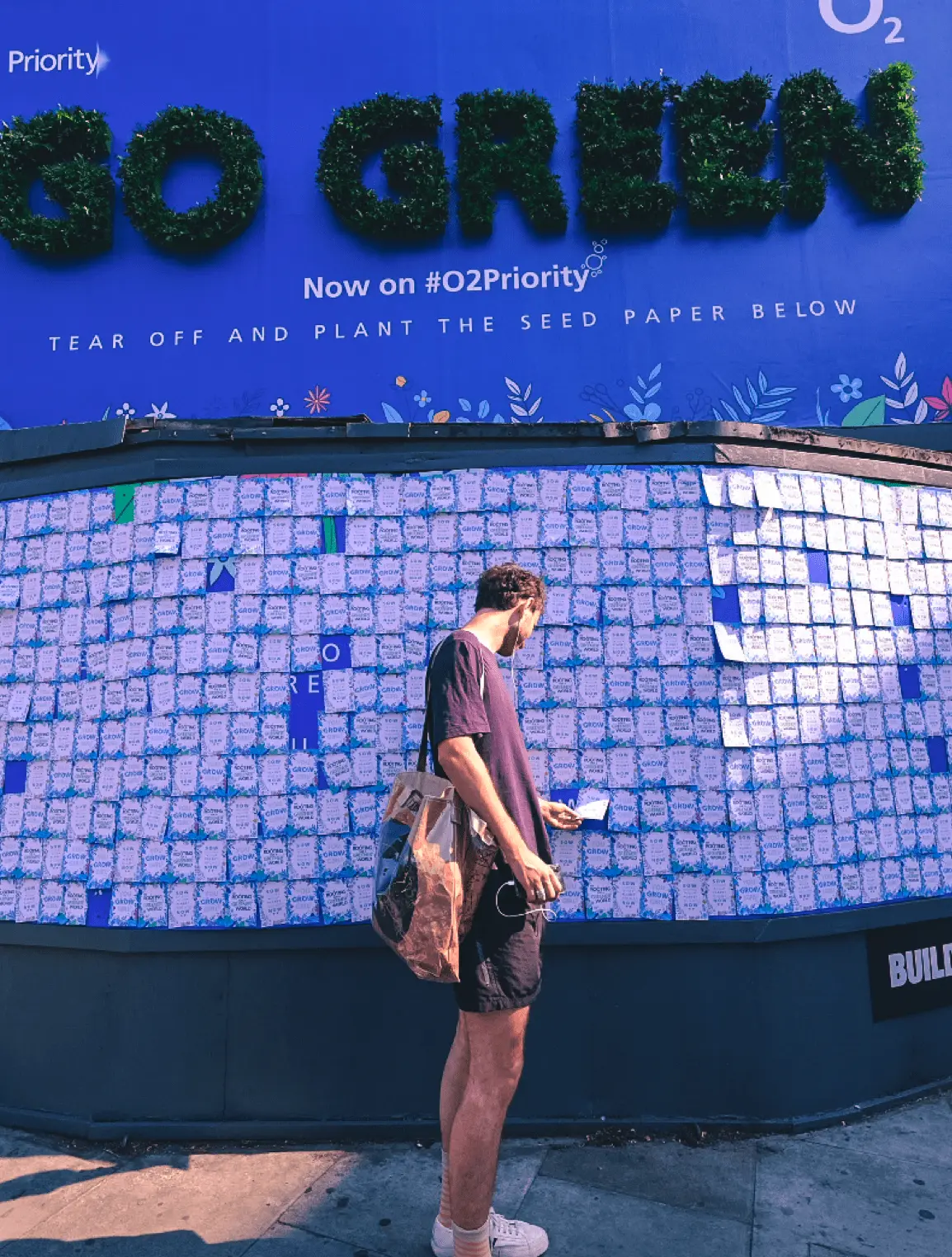 Guy looking at paper tiles