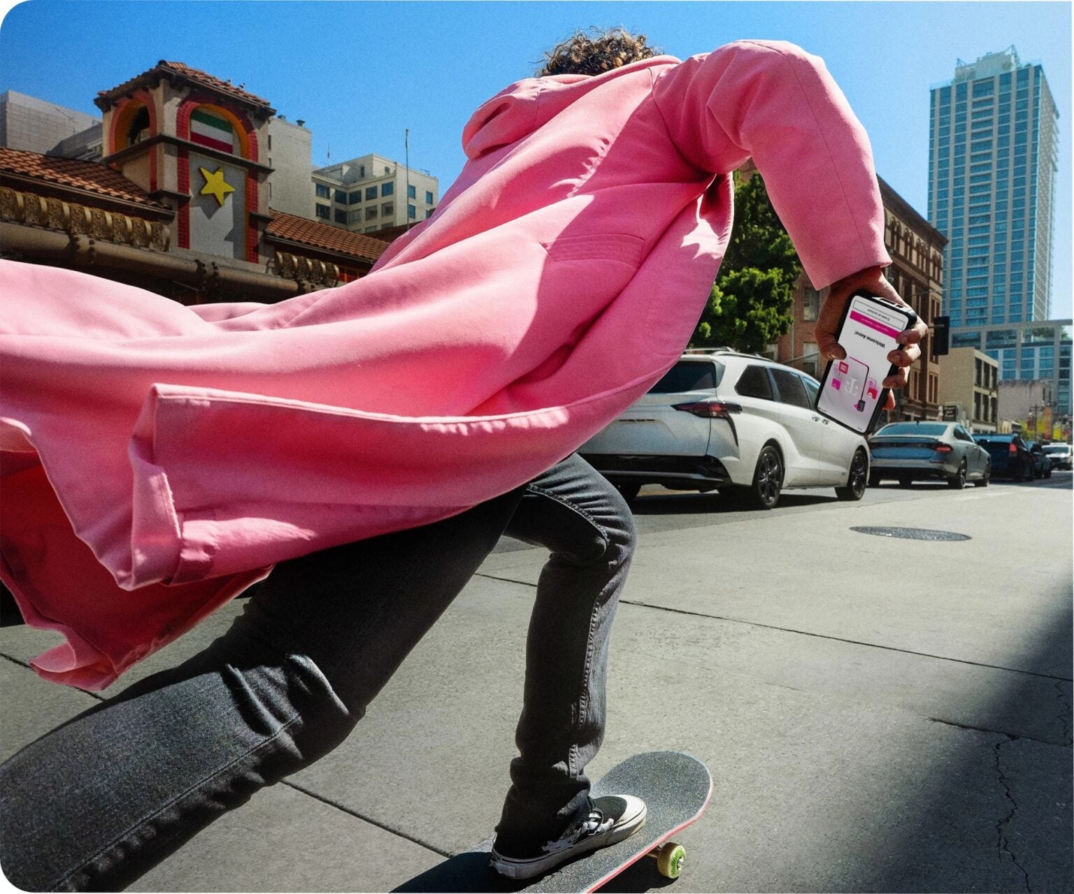 man in pink coat on skateboard