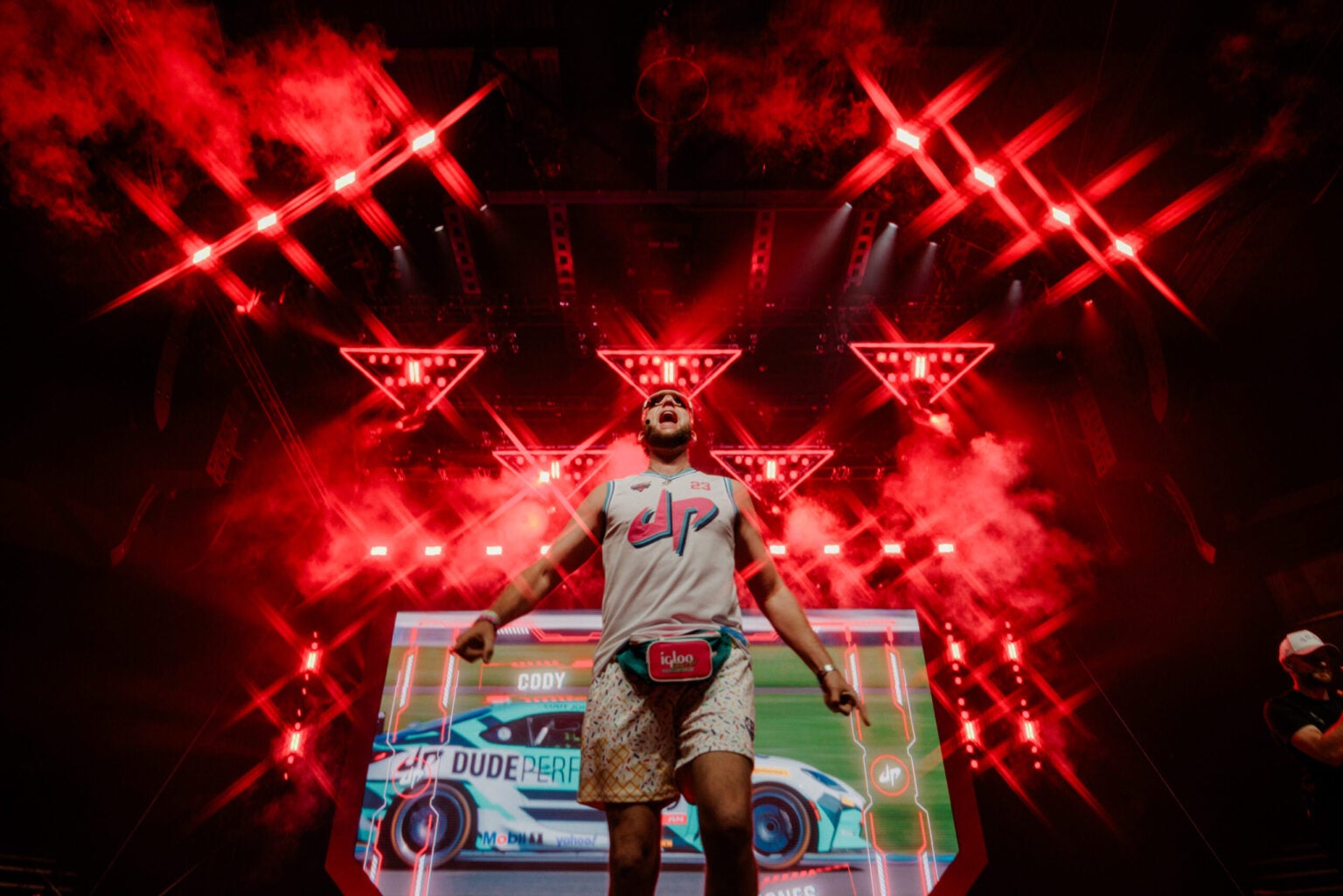 Dude Perfect member on stage with red lights